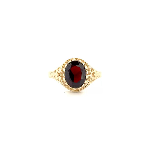 Oval Shape Garnet Set in 10K Yellow Gold Mount