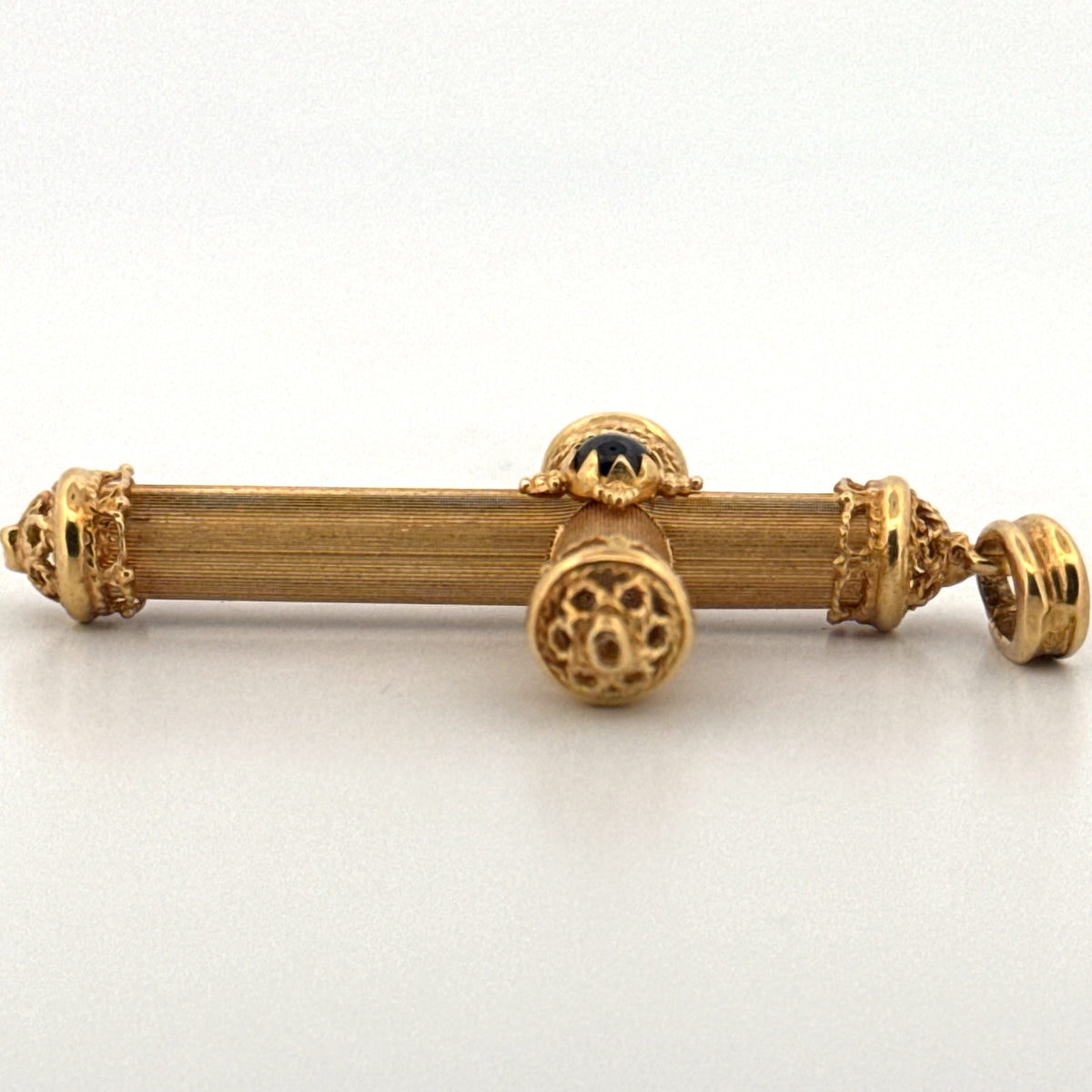 Cross Pendant Featuring a Ruby Cabochon in 18K Yellow Gold