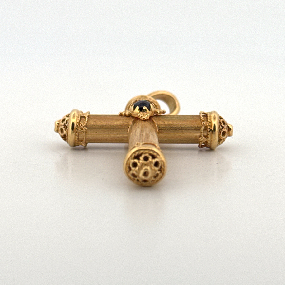 Cross Pendant Featuring a Ruby Cabochon in 18K Yellow Gold