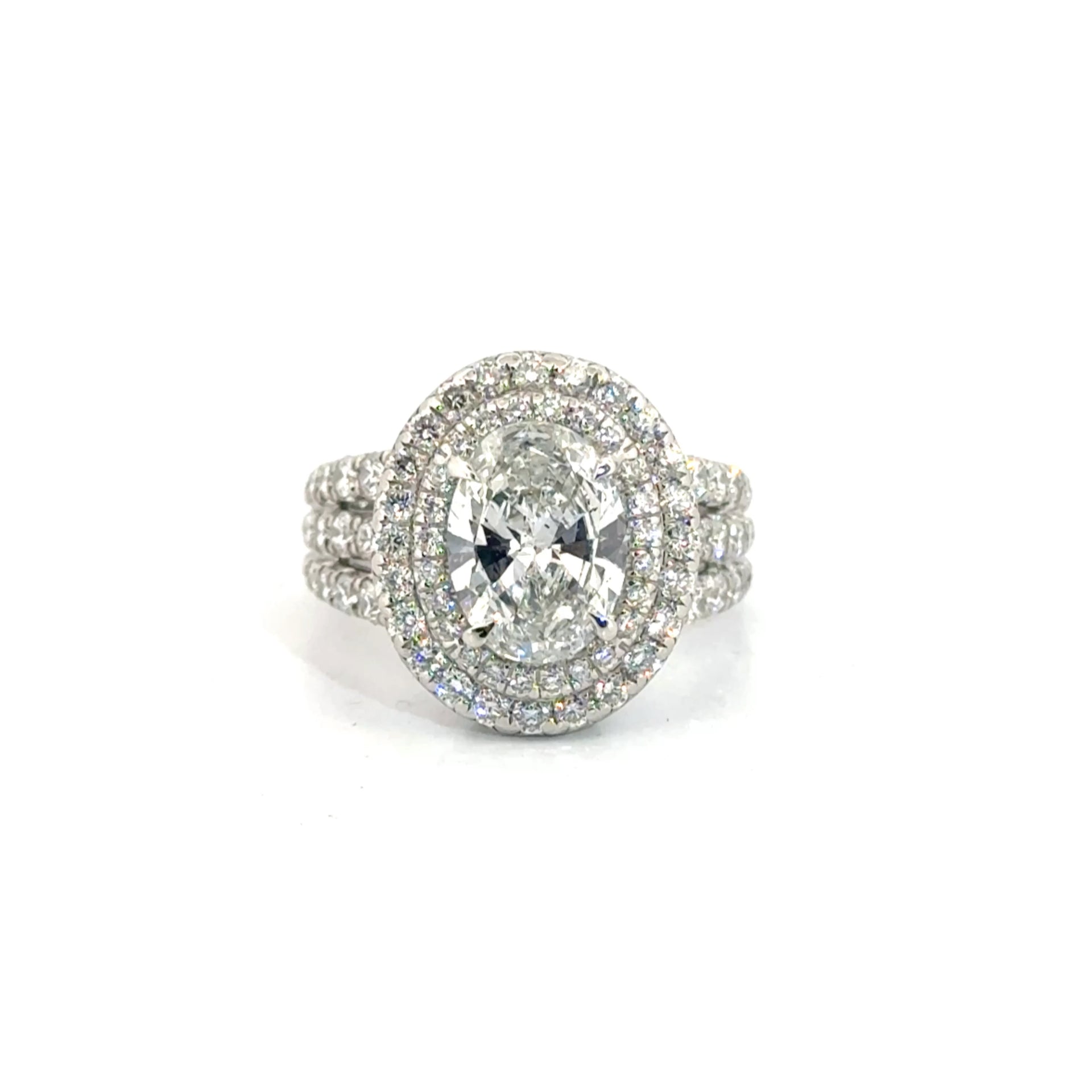 2.25ct. Natural Oval Diamond Approx H Color SI1 Clarity in a Charles Krypell Platinum Mounting featuring approx 2cttw Natural Accent Diamonds