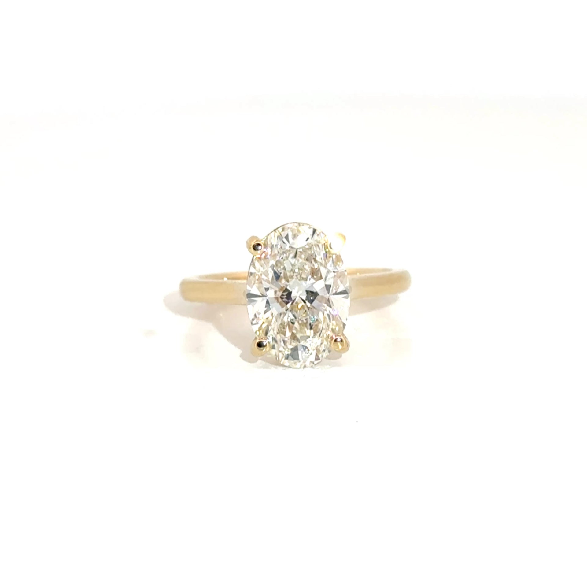 4.02ct. E VS1 Lab Grown Oval Set in 14K Yellow Gold Cathedral