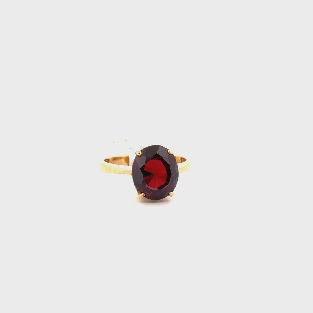 4.2ct. Oval Shape Garnet Solitaire Set in 18K Yellow Gold