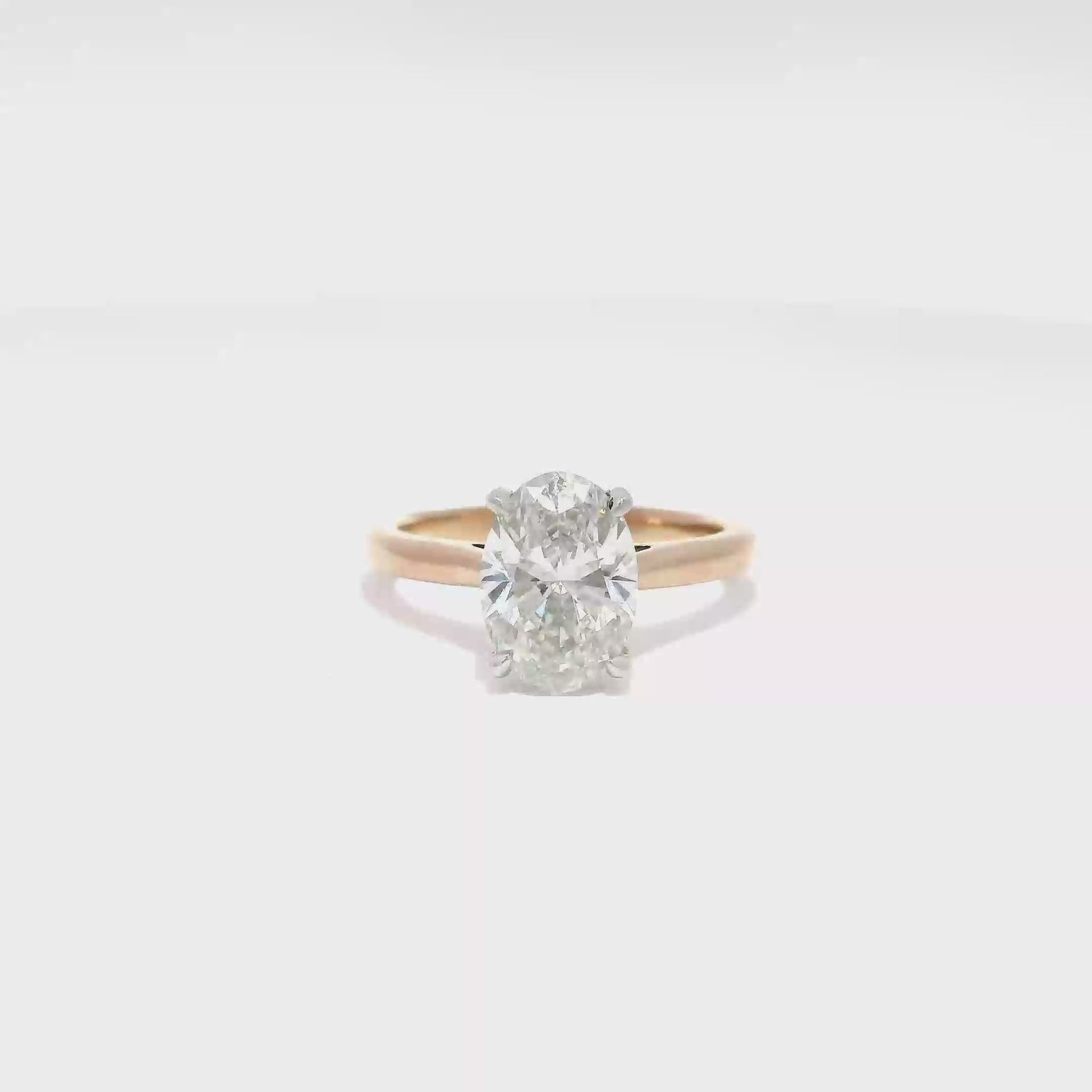 2.16ct. G VS1 Lab Grown Oval Diamond Set in 14K Rose Gold Cathedral Mounting