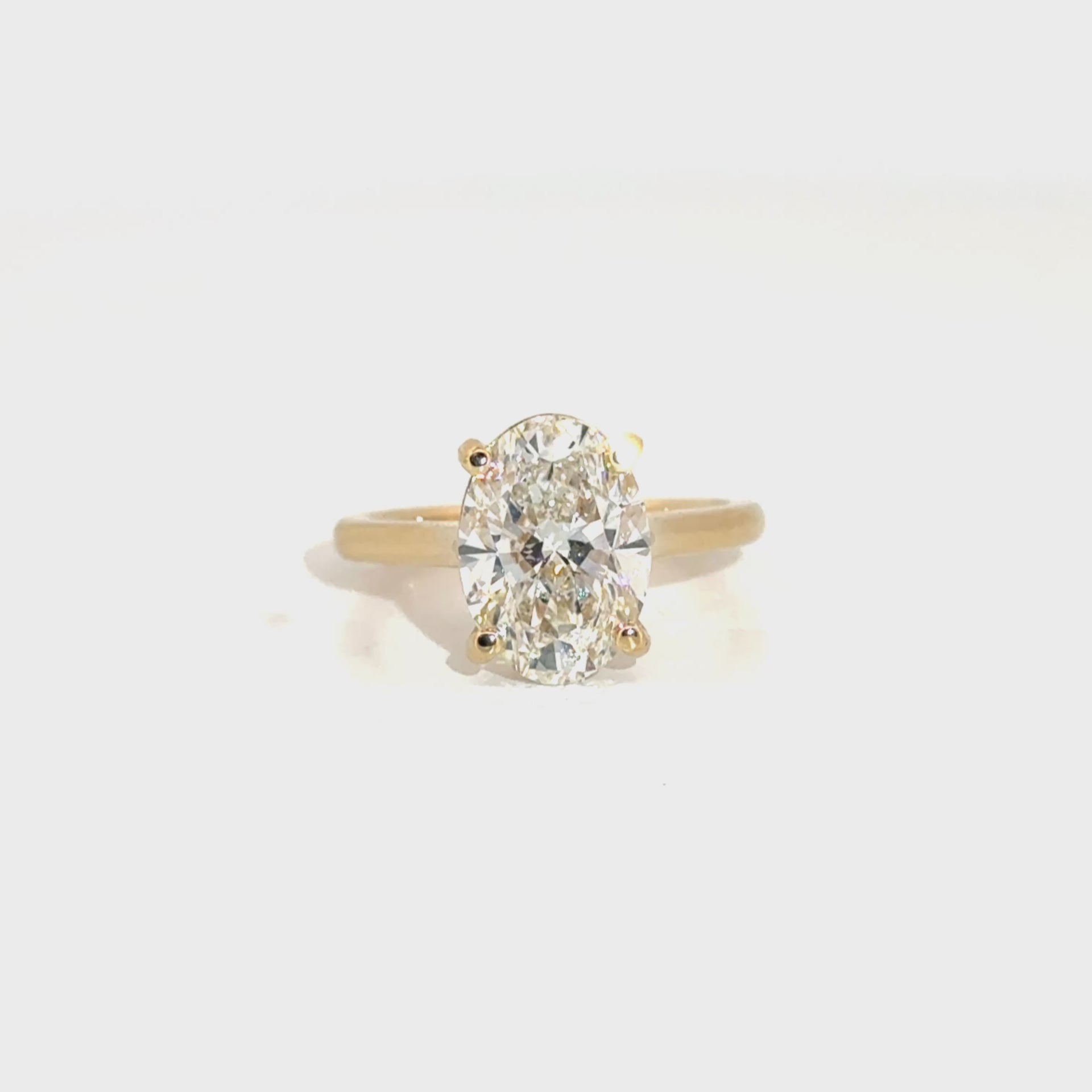 4.02ct. E VS1 Lab Grown Oval Set in 14K Yellow Gold Cathedral