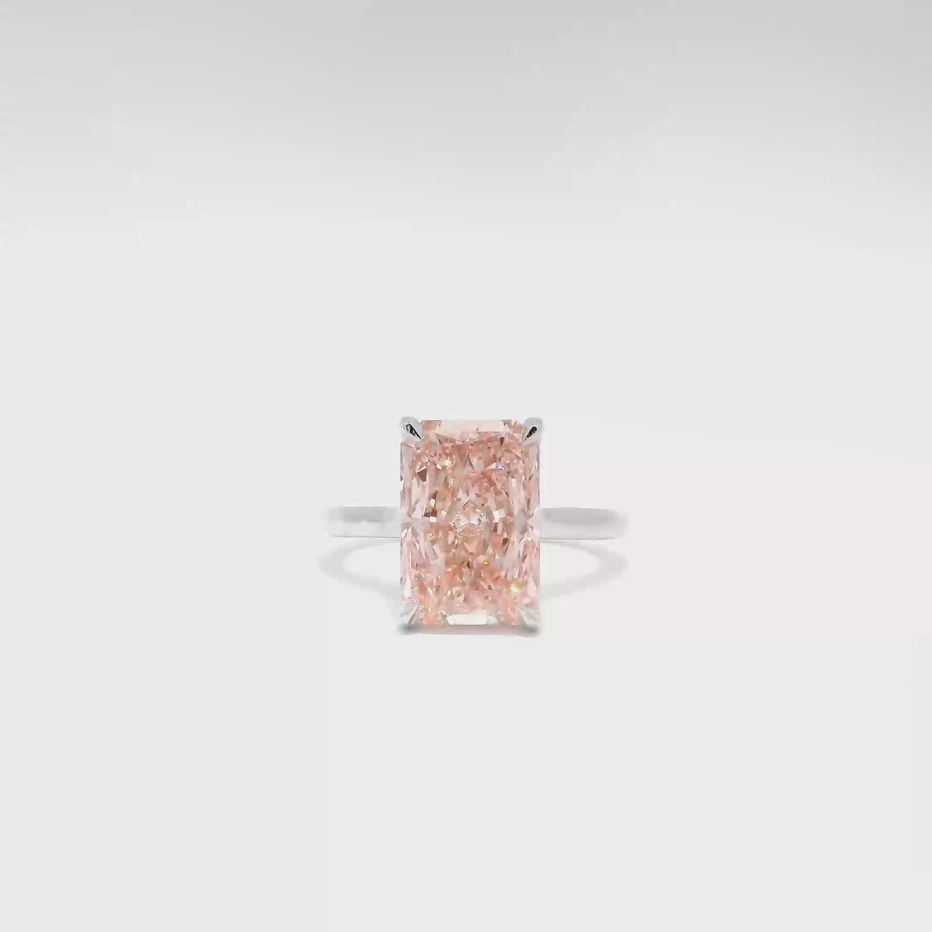 5.02ct. Fancy Vivid Pink VVS2 Elongated Radiant Diamond Set in 14K White Gold Cathedral Mounting