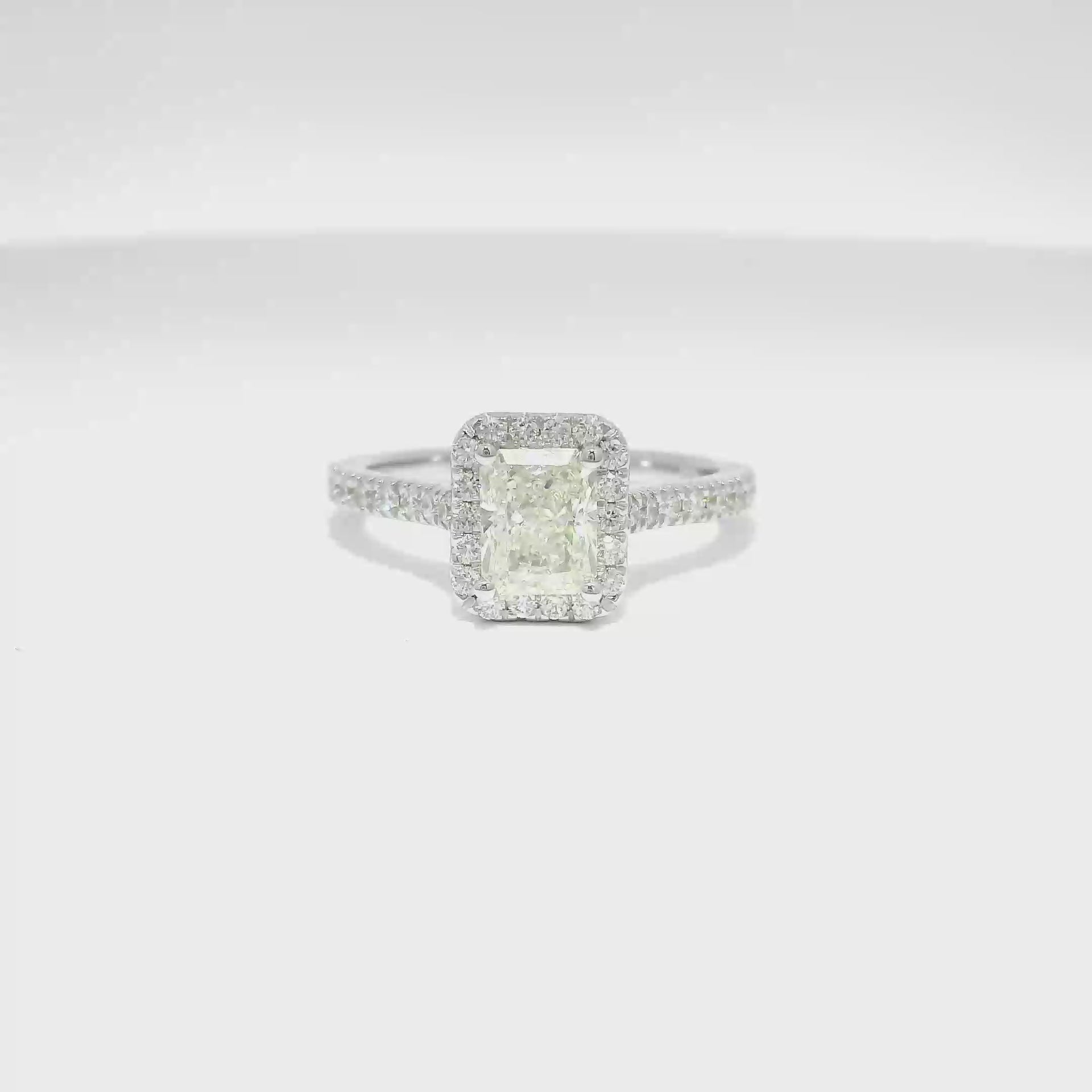 1.01ct. H SI1 Natural Elongated Radiant Set in 14K White Gold Diamond Halo Mounting (1.4cttw.)