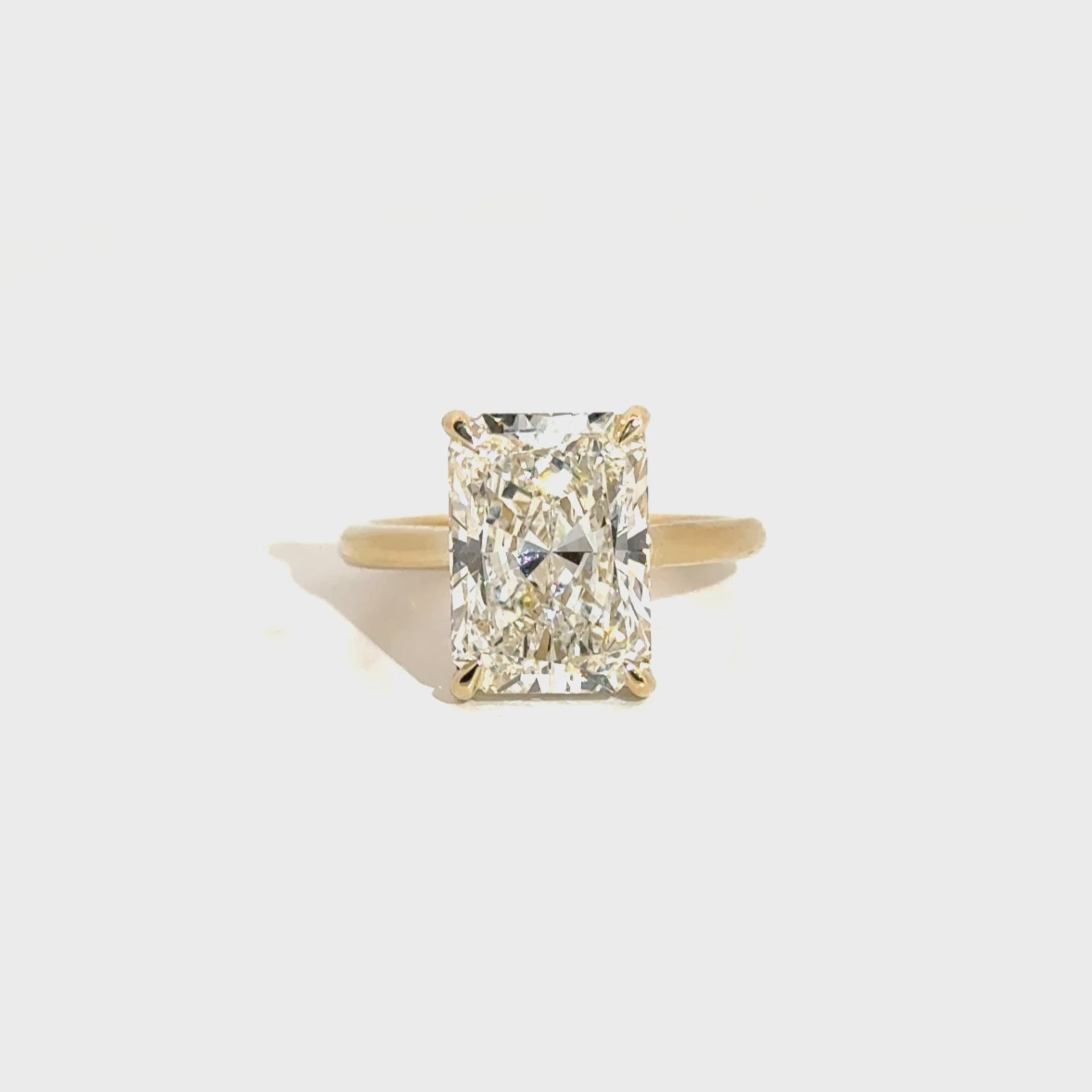 6.06ct. E VS1 Lab Grown Elongated Radiant Set in 14K Yellow Gold Cathedral